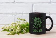 Black Coffee Mug Mockup with White Spiraea Flowers Poster 1