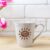 White Latte Mug Mockup with Magenta Tulip