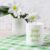 White Mug Mockup with Lily in Vase on Green Checkered Napkin